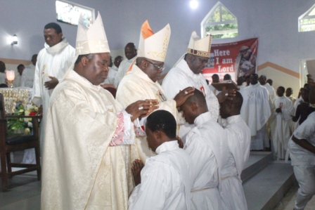 Laying of hands by the Bishop Olawoore, Archbishop Abegunrin and Bishop Badejo