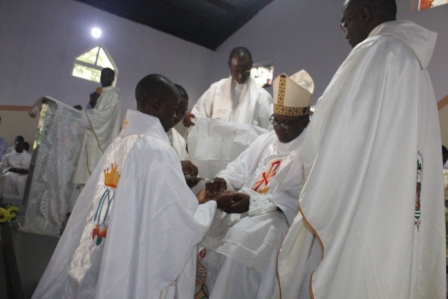 Anointing of Fr Matthew Oladosu's hands with chrism oil