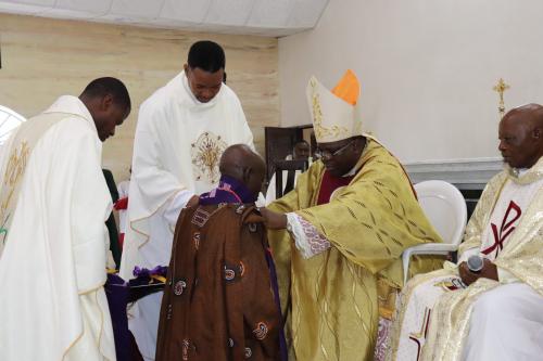 Bishop Badejo vesting the new Baba Ijo, Pa Samuel Ajao of St Peter's, Igbeti