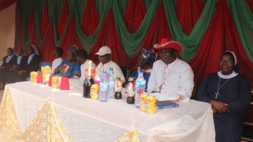 From R-L: Rev Sr Mary-Assumpta Taiwo SSMA, Bishop E.A. Badejo, Mrs Ajoni, Emeritus Bishop J.B. Adelakun, Seminarian John Ayanwola, Mrs Juliana Alade, Fr Gabriel Agboola and some religious on the table.
