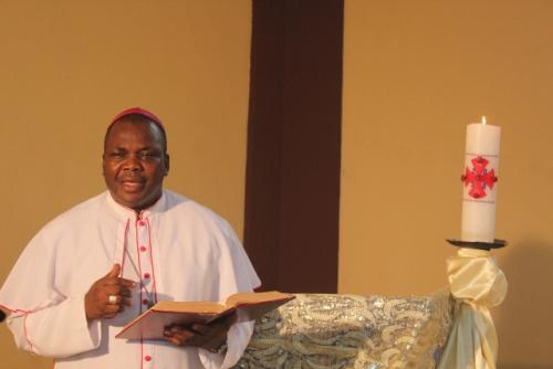 Bishop Badejo giving the message of hope and urging people to take comfort in the Word of God as preamble to his song titled "In the Word of God".